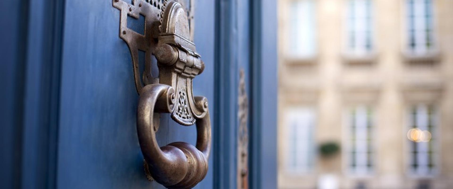 blue door with knocker opening