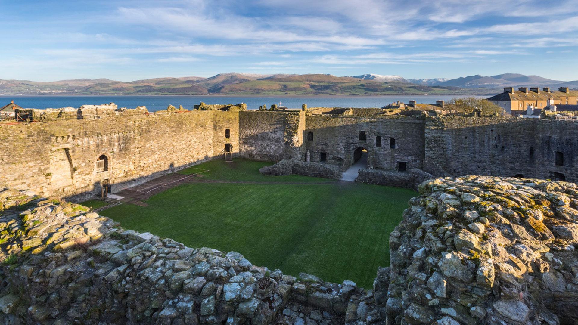 Beaumaris Castle view across the wall walks out towards the sea