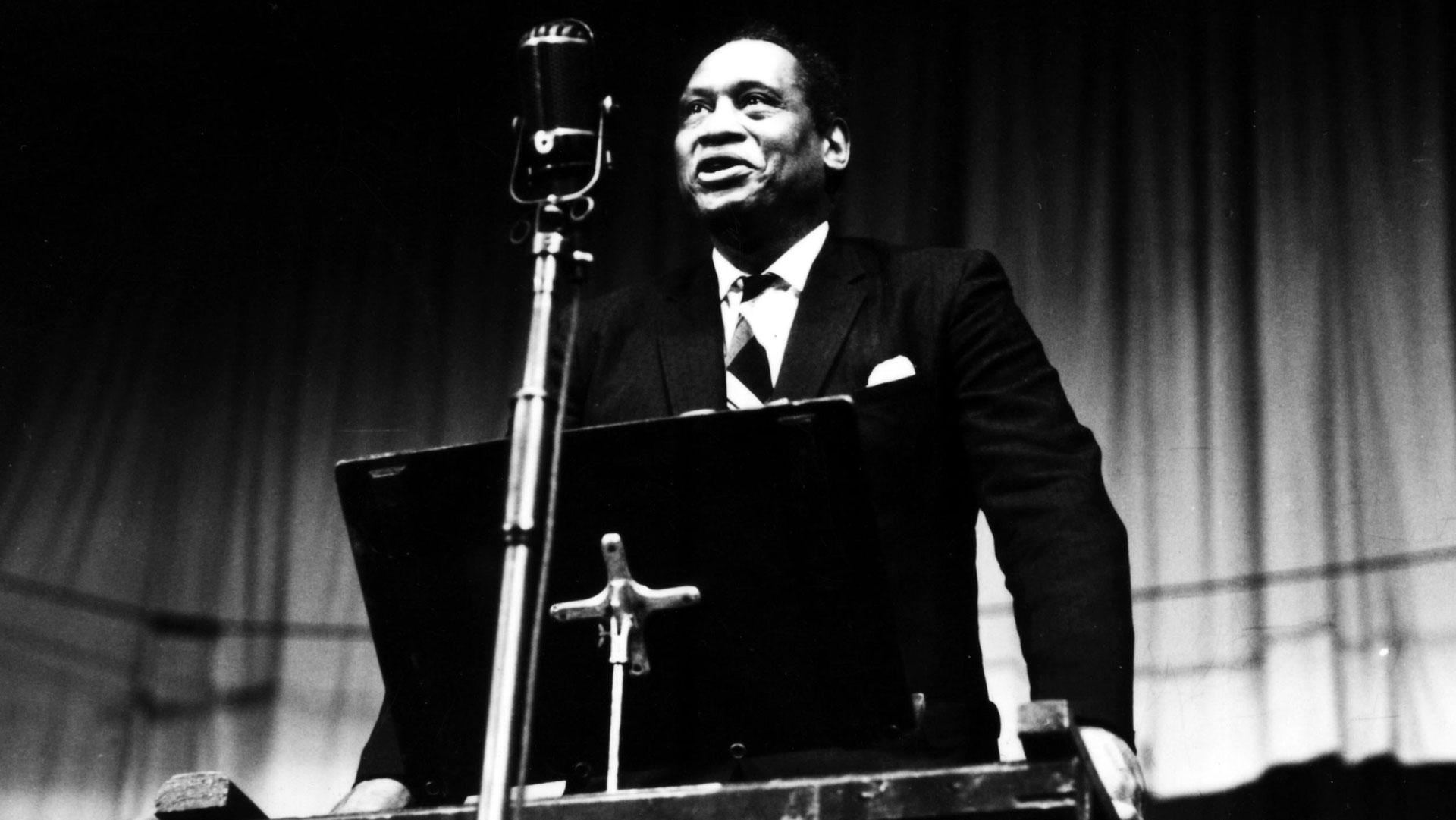 Paul Robeson standing at podium at National Eisteddfod, Ebbw Vale 1958
